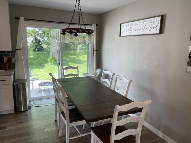 316 NW Linden St, Ankeny, IA 50023 - dining room featuring wood finished floors and baseboards