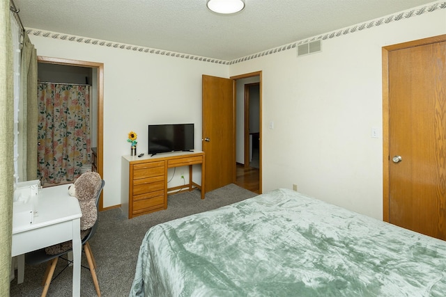 3719 SE 20th St, Des Moines, IA 50320 - bedroom with carpet floors, a textured ceiling, and an office area