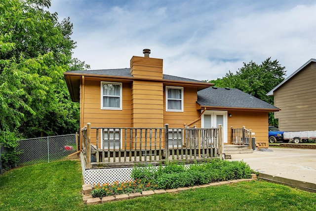 3719 SE 20th St, Des Moines, IA 50320 - rear view of property featuring a chimney, roof with shingles, and a deck