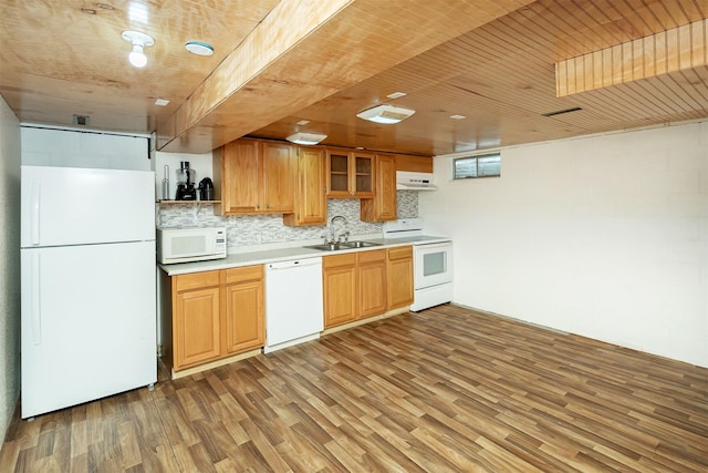 3719 SE 20th St, Des Moines, IA 50320 - kitchen with white appliances, under cabinet range hood, light wood-style flooring, light countertops, and glass insert cabinets