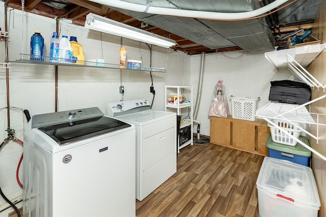 3719 SE 20th St, Des Moines, IA 50320 - laundry room with independent washer and dryer, wood finished floors, and concrete block wall