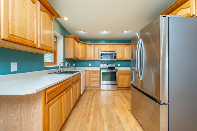 117 4th St NW, Altoona, IA 50009 - kitchen featuring stainless steel appliances, light wood-type flooring, light countertops, and recessed lighting