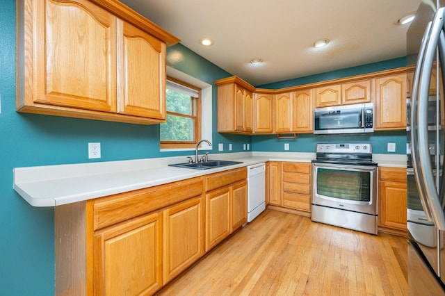117 4th St NW, Altoona, IA 50009 - kitchen featuring stainless steel appliances, light wood-type flooring, light countertops, and recessed lighting
