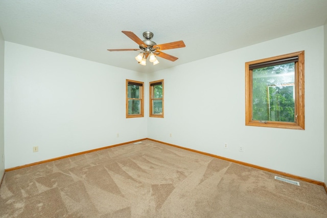 117 4th St NW, Altoona, IA 50009 - unfurnished room featuring carpet floors and a ceiling fan