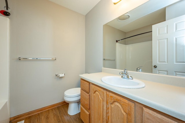 117 4th St NW, Altoona, IA 50009 - full bath featuring vanity, wood finished floors, a shower, and a bath
