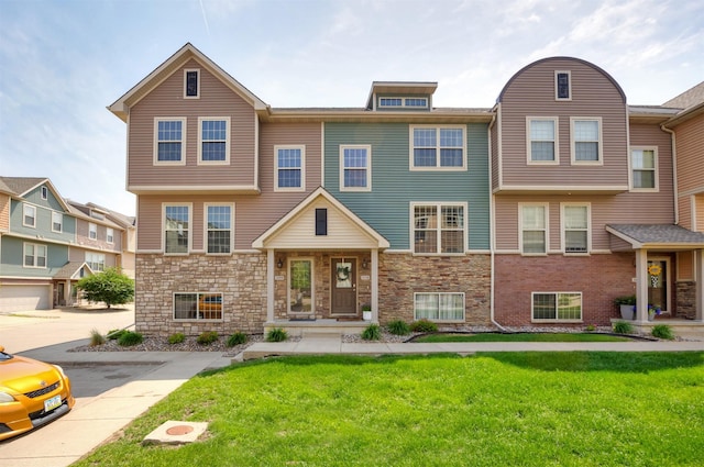 3600 SE Glenstone Dr Unit 308, Grimes, IA 50111 - multi unit property with a front yard and stone siding