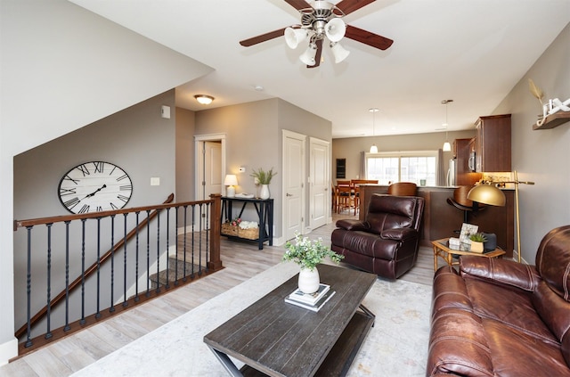 3600 SE Glenstone Dr Unit 308, Grimes, IA 50111 - living area with light wood-style flooring and ceiling fan