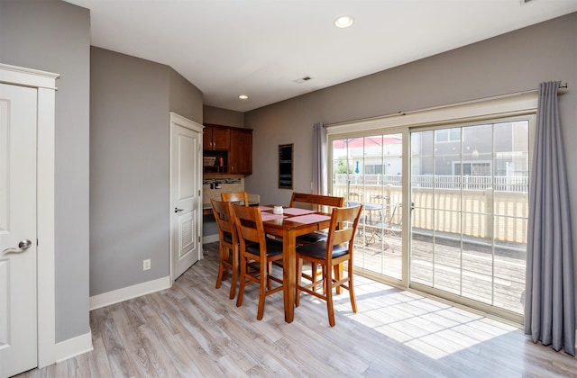 3600 SE Glenstone Dr Unit 308, Grimes, IA 50111 - dining space with light wood finished floors and recessed lighting