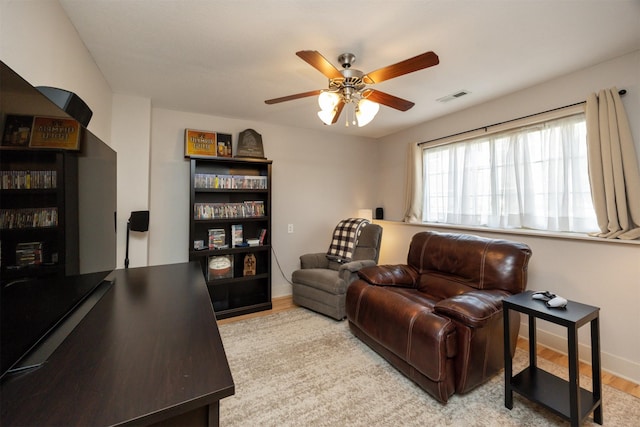 3600 SE Glenstone Dr Unit 308, Grimes, IA 50111 - living room featuring wood finished floors and a ceiling fan