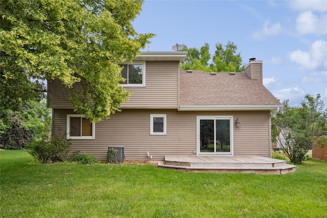 725 SE Peterson Dr, Ankeny, IA 50021 - back of house with a wooden deck, a chimney, a yard, and roof with shingles