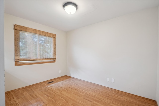 725 SE Peterson Dr, Ankeny, IA 50021 - unfurnished room featuring wood finished floors