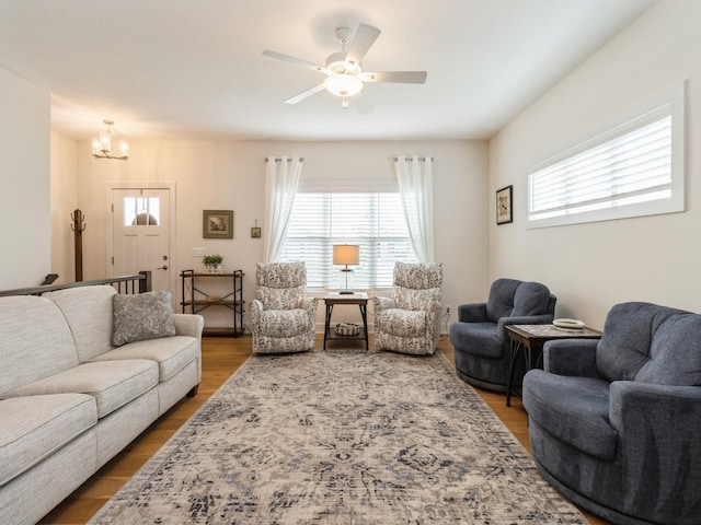 2206 SW Westwood St, Ankeny, IA 50023 - living room featuring a chandelier, ceiling fan, and wood finished floors
