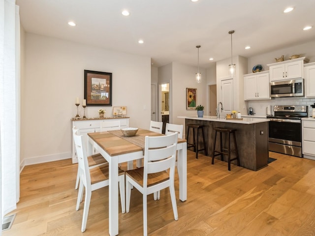 2206 SW Westwood St, Ankeny, IA 50023 - dining room featuring recessed lighting and light wood finished floors