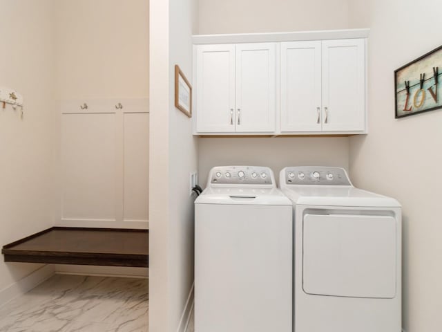 2206 SW Westwood St, Ankeny, IA 50023 - laundry area with independent washer and dryer, cabinet space, and marble look tile flooring