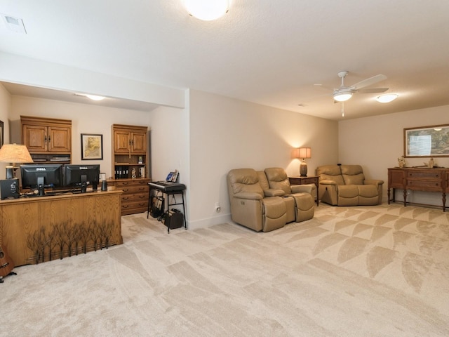 2206 SW Westwood St, Ankeny, IA 50023 - living area featuring light colored carpet, a ceiling fan, and an office area