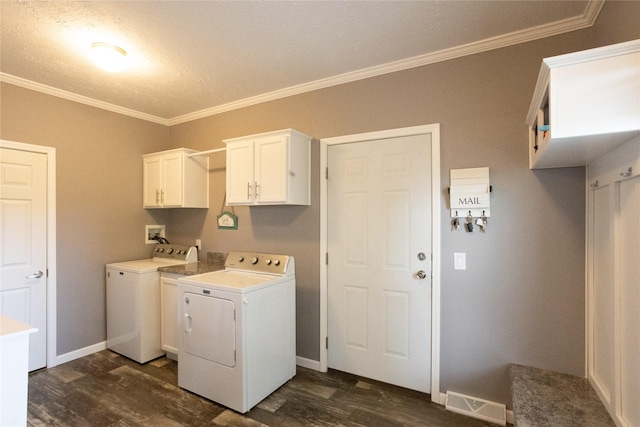 2006 10th St, Eldora, IA 50627 - washroom with washer and clothes dryer, cabinet space, dark wood finished floors, crown molding, and a textured ceiling