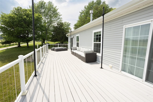 2006 10th St, Eldora, IA 50627 - wooden deck with a lawn and an outdoor hangout area