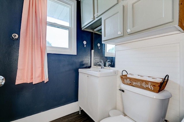 911 E 1st Ave, Indianola, IA 50125 - bathroom featuring toilet and a sink