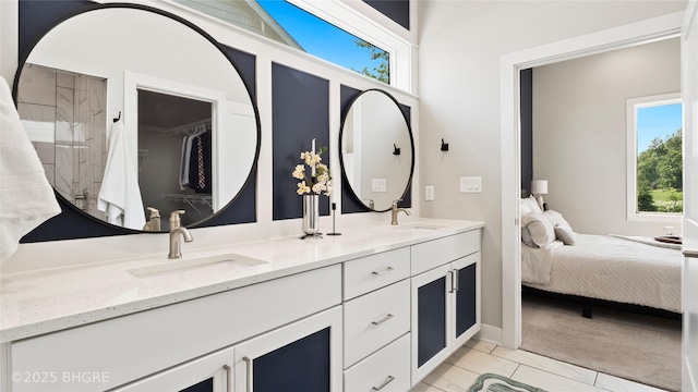 780 NE Badger Ln, Waukee, IA 50263 - ensuite bathroom with double vanity and marble look tiles