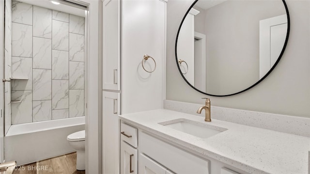 780 NE Badger Ln, Waukee, IA 50263 - full bathroom featuring vanity, wood finished floors, and tub / shower combination