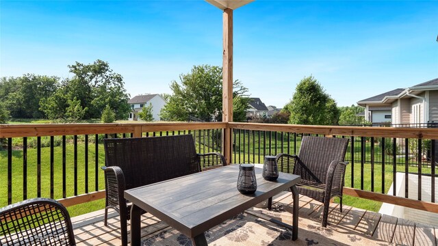 780 NE Badger Ln, Waukee, IA 50263 - wooden terrace featuring a lawn
