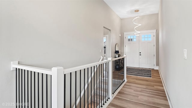 780 NE Badger Ln, Waukee, IA 50263 - entrance foyer with light wood-type flooring and baseboards