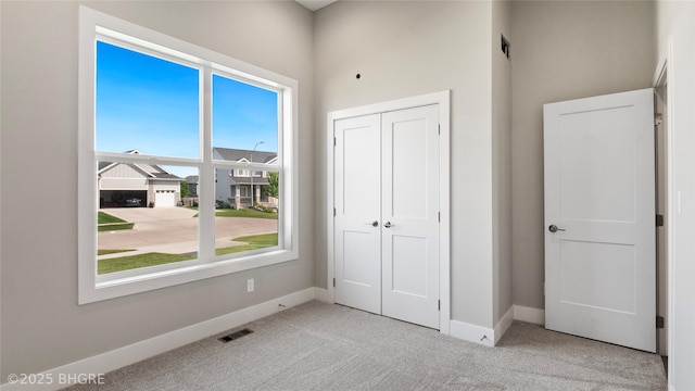 780 NE Badger Ln, Waukee, IA 50263 - unfurnished bedroom featuring carpet floors and a closet