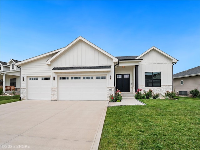 780 NE Badger Ln, Waukee, IA 50263 - modern farmhouse style home with board and batten siding, stone siding, an attached garage, a front yard, and driveway