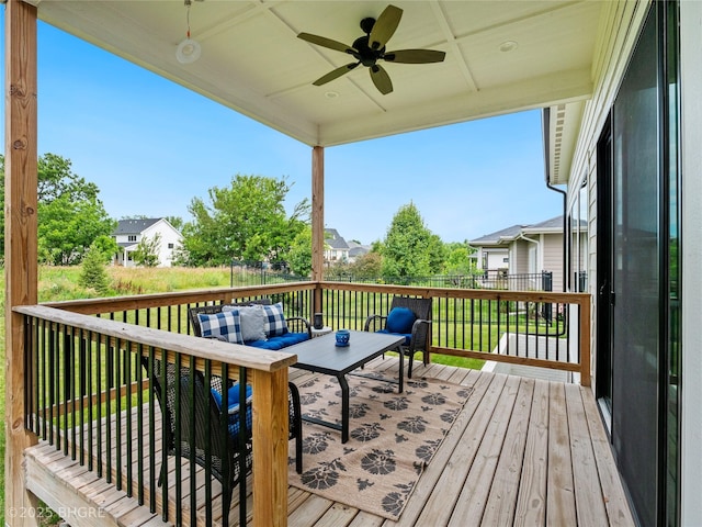 780 NE Badger Ln, Waukee, IA 50263 - wooden deck featuring a ceiling fan, an outdoor living space, and a residential view