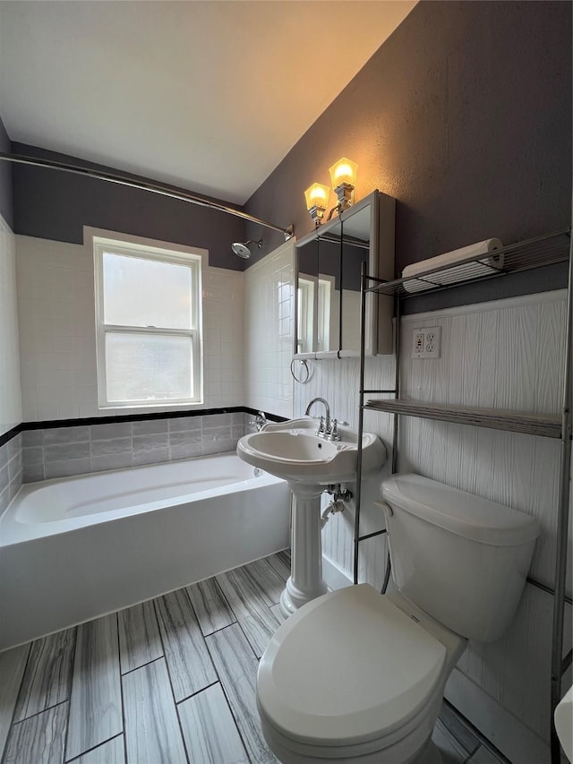 2712 49th St, Des Moines, IA 50310 - bathroom featuring toilet and bathtub / shower combination