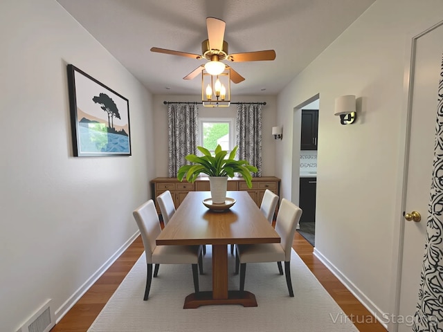 2712 49th St, Des Moines, IA 50310 - dining area with dark wood-style flooring and a ceiling fan
