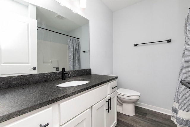 481 10th St, Waukee, IA 50263 - bathroom featuring vanity, wood finished floors, and a shower with curtain
