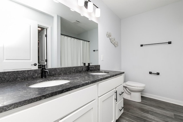 481 10th St, Waukee, IA 50263 - full bathroom with double vanity, wood finished floors, and a shower with shower curtain