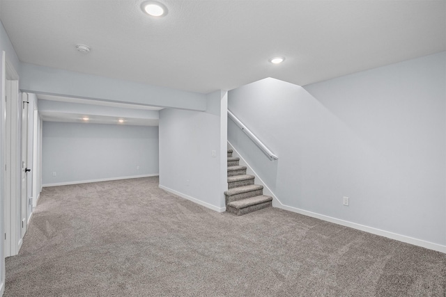 481 10th St, Waukee, IA 50263 - finished below grade area featuring stairs, carpet flooring, and recessed lighting