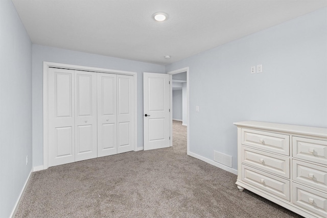 481 10th St, Waukee, IA 50263 - unfurnished bedroom featuring carpet flooring and a closet