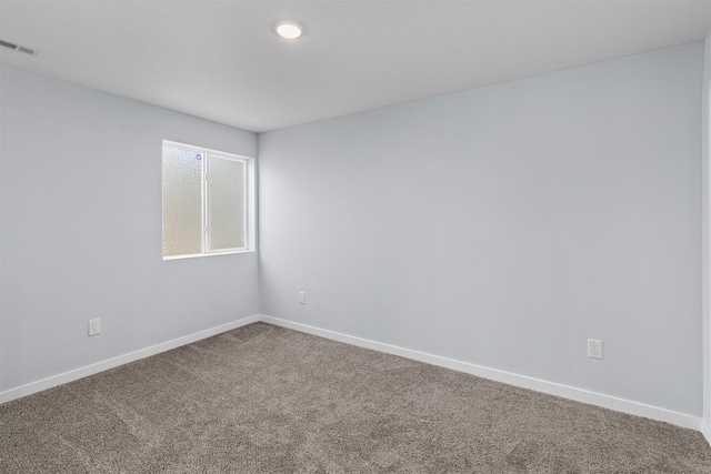 481 10th St, Waukee, IA 50263 - empty room featuring carpet and baseboards