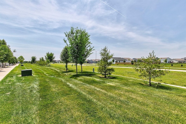 481 10th St, Waukee, IA 50263 - view of green lawn featuring a residential view
