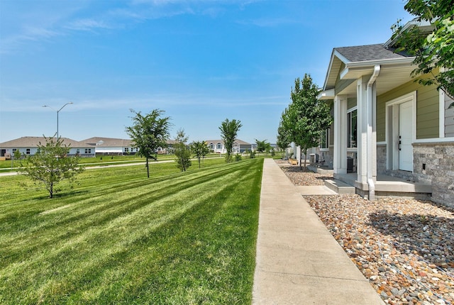 481 10th St, Waukee, IA 50263 - view of green lawn featuring a residential view