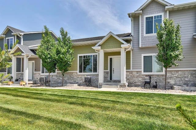 481 10th St, Waukee, IA 50263 - craftsman house featuring a front yard and stone siding