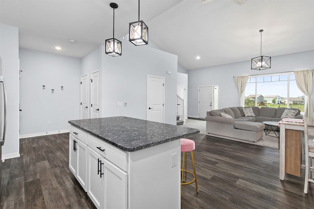 481 10th St, Waukee, IA 50263 - kitchen featuring a center island, white cabinets, dark wood-style floors, pendant lighting, and recessed lighting
