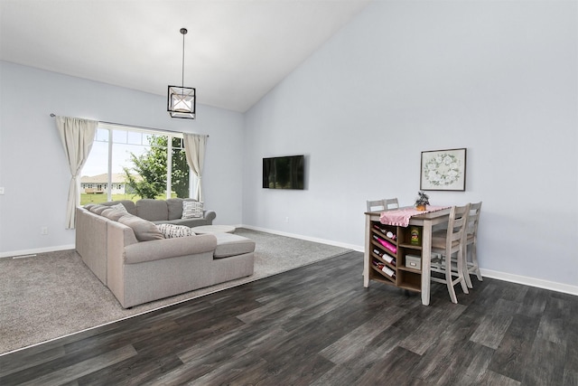 481 10th St, Waukee, IA 50263 - living area with high vaulted ceiling and dark wood finished floors