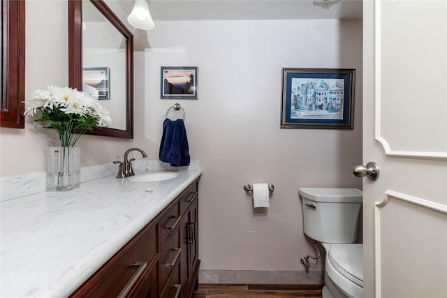 3663 Grand Ave Unit 604, Des Moines, IA 50312 - half bathroom with vanity and wood finished floors