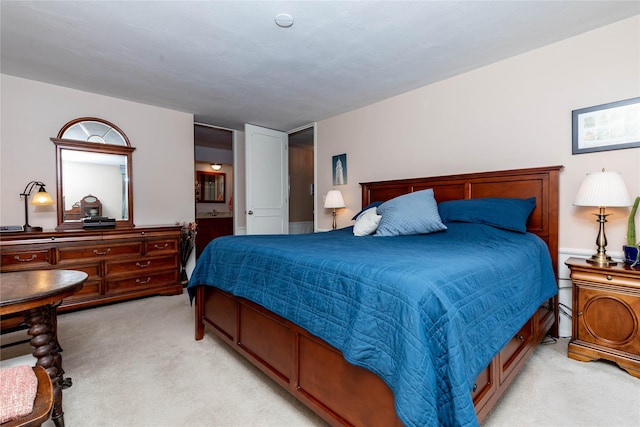 3663 Grand Ave Unit 604, Des Moines, IA 50312 - bedroom featuring light carpet and ensuite bath