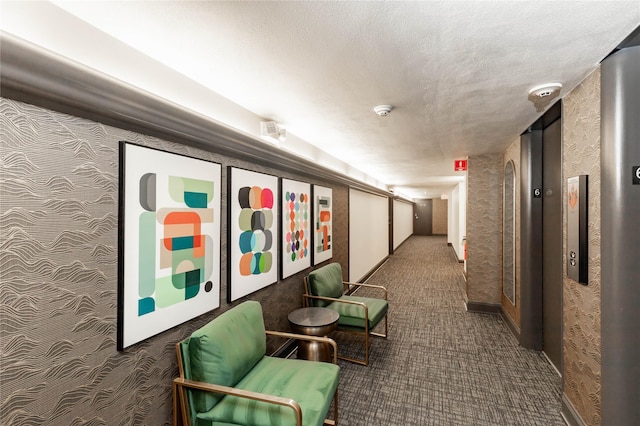 3663 Grand Ave Unit 604, Des Moines, IA 50312 - corridor featuring carpet, a textured ceiling, and elevator