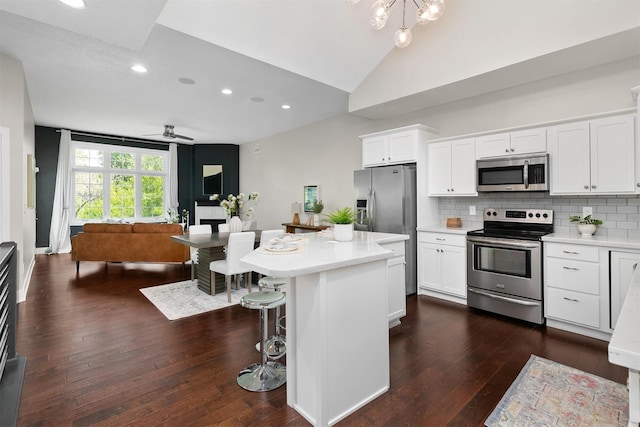 14186 Pinnacle Pointe Dr Unit 86, Clive, IA 50325 - kitchen with appliances with stainless steel finishes, open floor plan, light countertops, white cabinets, and recessed lighting