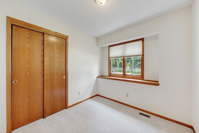 4855 Coachlight Dr, West Des Moines, IA 50265 - unfurnished bedroom featuring carpet floors and a closet