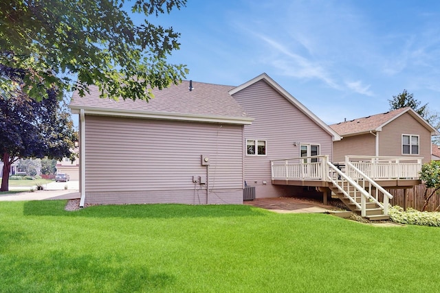 4855 Coachlight Dr, West Des Moines, IA 50265 - rear view of house featuring a deck, a yard, roof with shingles, and stairs