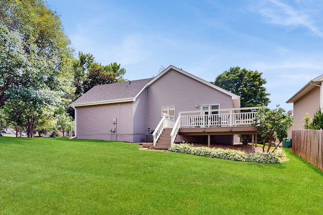 4855 Coachlight Dr, West Des Moines, IA 50265 - back of property with a wooden deck and roof with shingles