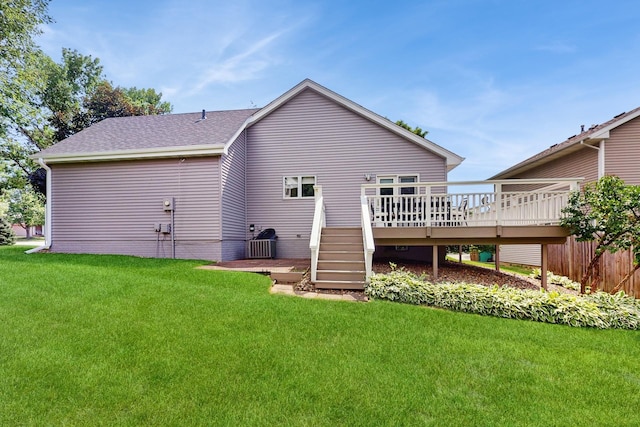 4855 Coachlight Dr, West Des Moines, IA 50265 - back of house with a wooden deck, a lawn, and a shingled roof