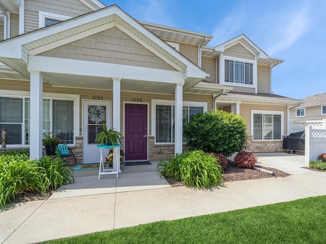 1155 NE 7th Ln, Ankeny, IA 50021 - view of front of property with stone siding and a porch